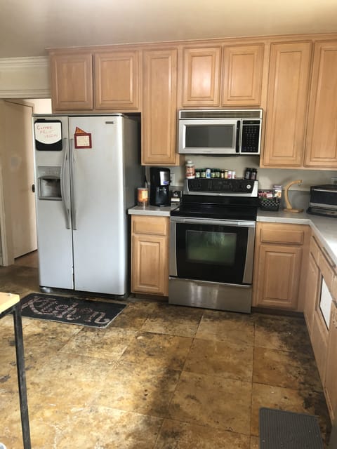 Kitchen full of appliances, spices, etc.