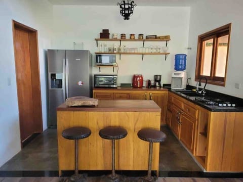 Villa | Private kitchen | Full-size fridge, microwave, oven, stovetop