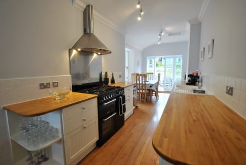 The well-equipped kitchen has plenty of space for cooking and preparing meals