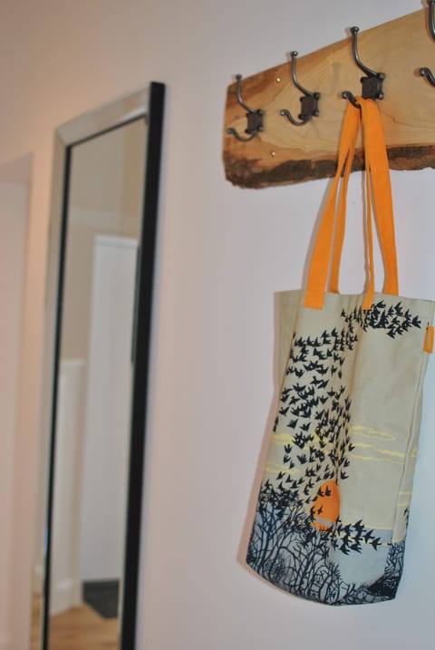 Numbered coat hooks, reminiscent of school days