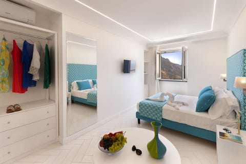 Royal Quadruple Room, Sea View | Minibar, in-room safe, individually decorated, individually furnished