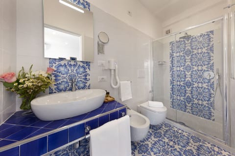 Panoramic Room, Balcony, Sea View | Bathroom | Shower, rainfall showerhead, hair dryer, bathrobes