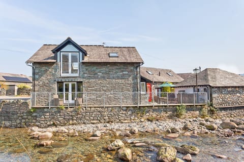 River in front of Forge Bridge Cottage in Coniston Lake District