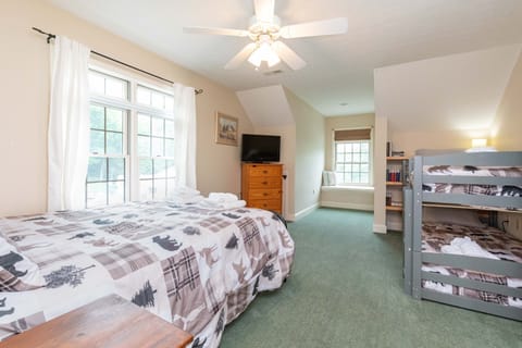 The upstairs bedroom contains a Queen, along with a twin bunk bed.