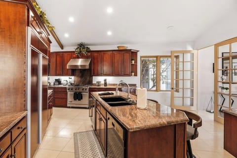 Large open kitchen with island seating and lots of prep room.