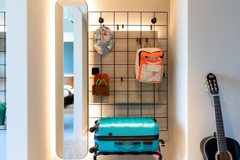 Hypo-allergenic bedding, desk, laptop workspace, blackout drapes