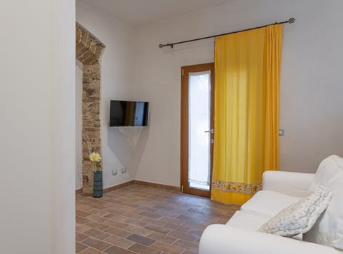 Condo | Living room | 32-inch LCD TV with satellite channels, TV