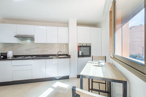 Deluxe Apartment, 2 Bedrooms, Balcony | Private kitchen | Full-size fridge, microwave, oven, stovetop