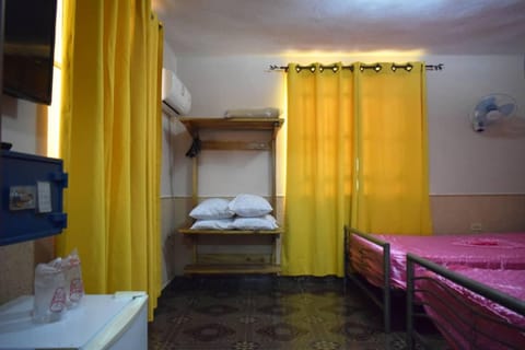 Family Triple Room | Minibar, in-room safe, individually decorated, individually furnished