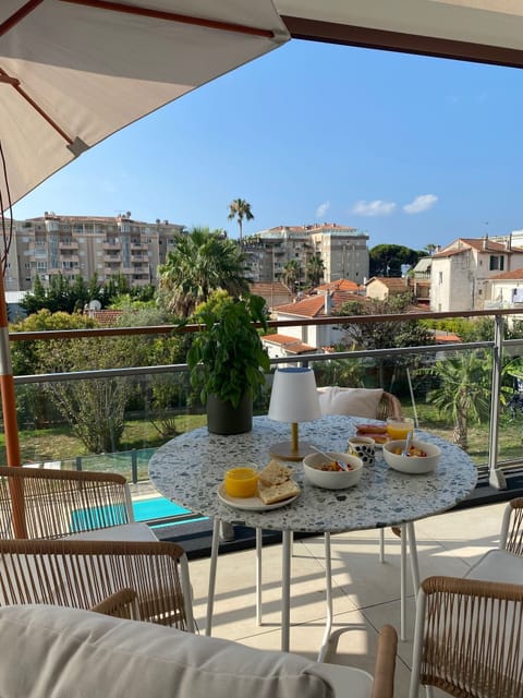The balcony with the pool in the background
