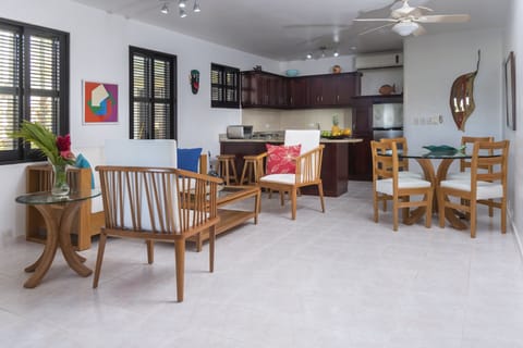 Apartment, Ocean View, Beachfront | Living area | Flat-screen TV