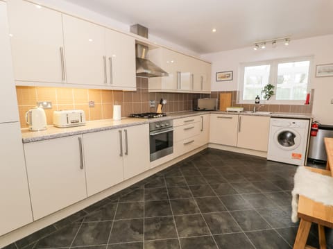 Fridge, electric kettle, toaster, cookware/dishes/utensils