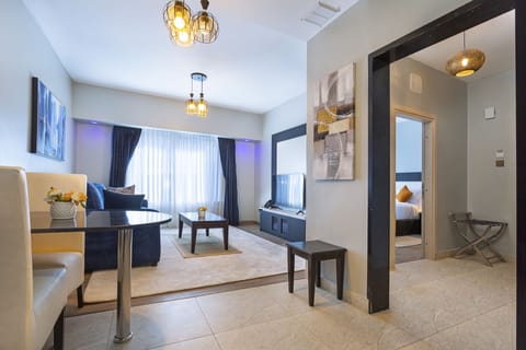 Deluxe Suite | Living area | 40-inch Smart TV with digital channels, TV, Netflix