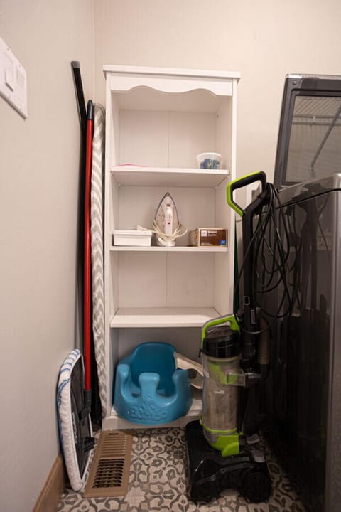 Laundry Room with Washer and Dryer, Cleaning supplies, Iron Board, Bumbo Chair
