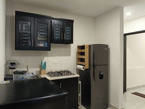 Superior Suite | Private kitchen | Coffee/tea maker, dining tables