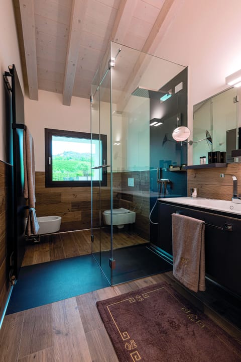 Luxury Condo | Bathroom | Rainfall showerhead, hair dryer, bathrobes, slippers