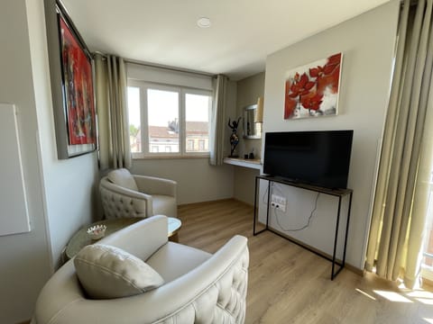 Deluxe Apartment (Coco Chanel) | Living area | 100-cm flat-screen TV with cable channels