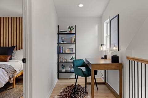 On the other side of the third-floor reading nook, you'll find a convenient office desk and chair, complete with a reading light and bookshelf.