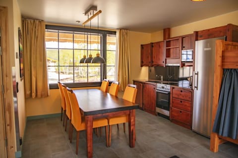 Shaman Family Room | Private kitchen | Full-size fridge, microwave, electric kettle, highchair