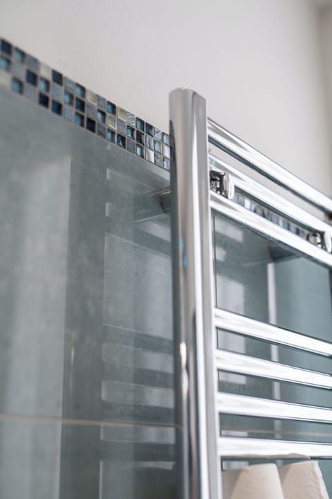 Shower, rainfall showerhead, designer toiletries, hair dryer