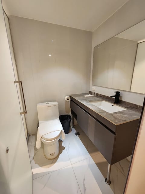 Standard Double Room | Bathroom | Shower, slippers, towels