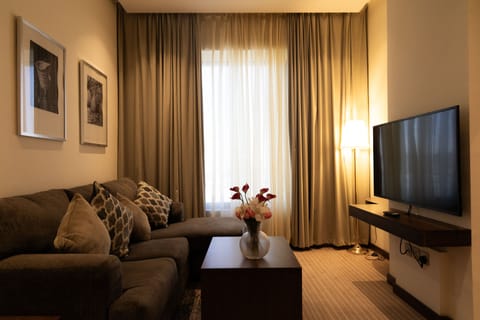 Executive Apartment | Living area | 50-inch LCD TV with satellite channels, TV, offices