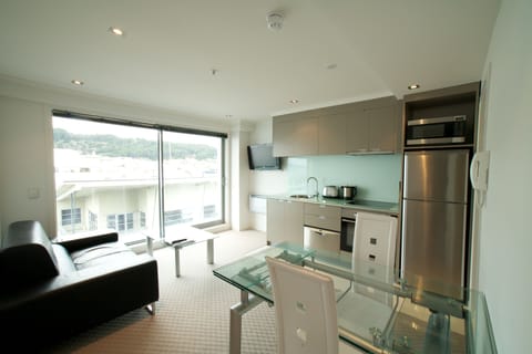 Standard One Bedroom | Living area | Flat-screen TV