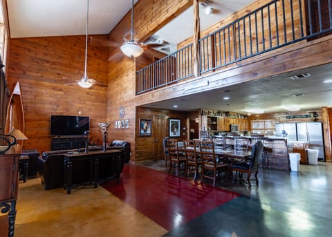 Living room view of dining table and kitchen