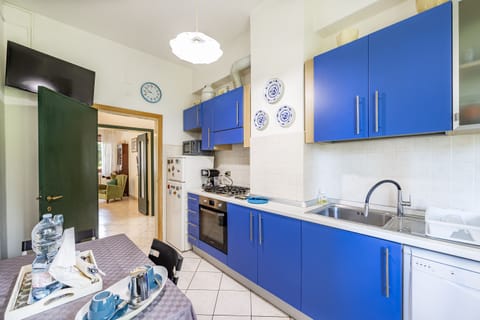 Family Apartment, 2 Bedrooms (I Giardini al Mare 500mt From Sea) | Private kitchen | Fridge, microwave, oven, stovetop