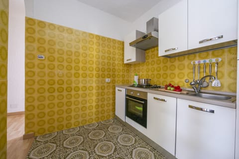 Family Apartment, 1 Bedroom (Baia Degli Dei Bilo Close To Taormina) | Private kitchen | Fridge, oven, stovetop, cookware/dishes/utensils