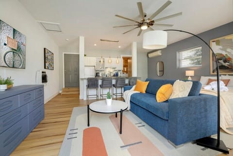 Our studio-style Primary Suite is complete with a Queen-size bed, Queen-size pullout bed, closet, dresser, 58-inch Hisense Roku TV, bathroom, kitchenette and living room.