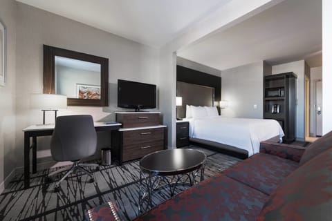 Suite, 1 King Bed | Living area | 36-inch flat-screen TV with satellite channels, TV, iPod dock