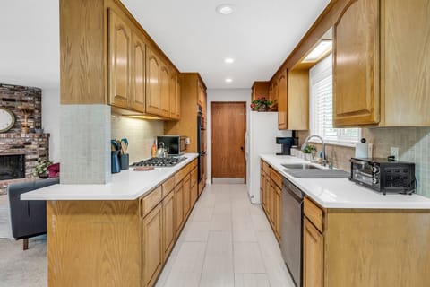 Fully stocked kitchen with gas stove and double ovens
