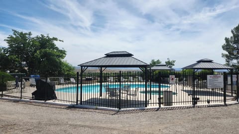 Seasonal outdoor pool, open 7:00 AM to 11:00 PM, pool umbrellas