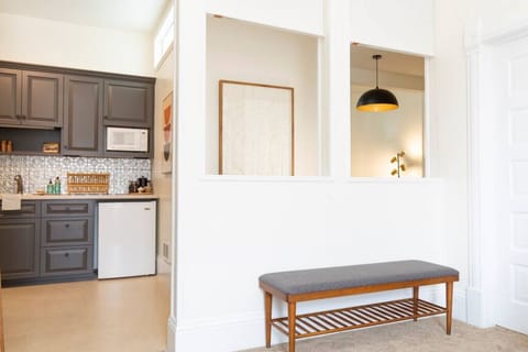 Queen size bed in the bedroom with a full size bathroom connected to it.