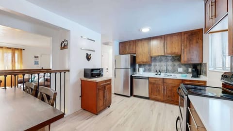 Enjoy a spacious kitchen fully equipped with modern appliances, ample counter space, and all the essentials for cooking and dining. Whether you're preparing a homemade meal or enjoying a quick snack, this kitchen offers both convenience and comfort.