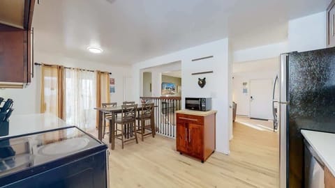 Enjoy a large kitchen area with plenty of counter space, modern appliances, and all the essentials for cooking and dining.