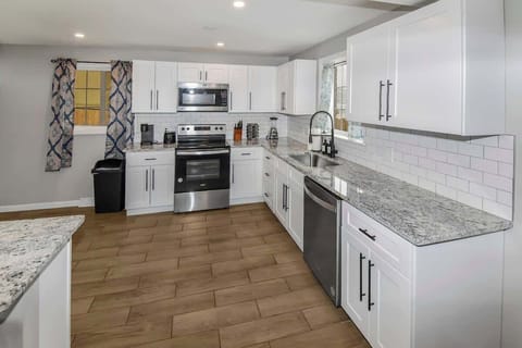 The fully equipped kitchen offers everything you need to prepare delicious meals, featuring modern appliances, ample counter space, and plenty of storage. 