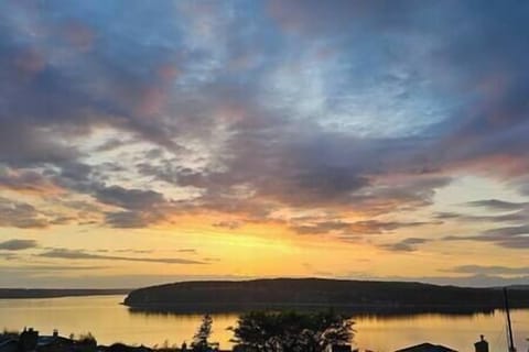 Relax and enjoy amazing sunsets from the comforts of the living room or on the deck.