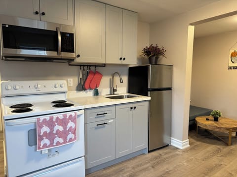 Two Bedrooms (Incl. 2 Twin) | Private kitchen | Full-size fridge, microwave, oven, stovetop