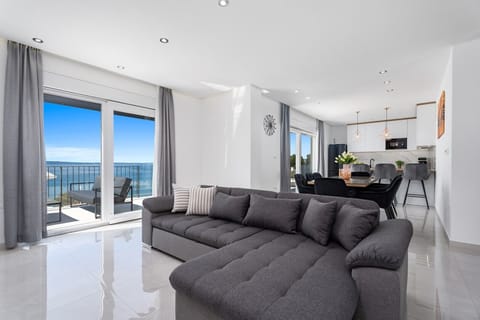 The ground floor offers a spacious living and dining area (44 sqm)