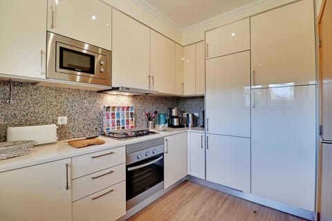 Apartment, 2 Bedrooms, Pool Access | Private kitchen | Microwave, dishwasher, coffee/tea maker, electric kettle