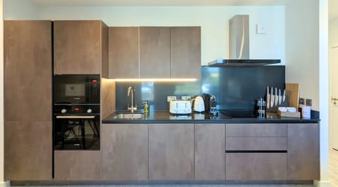 Two Bedroom Apartment | Private kitchen | Fridge, microwave, oven, dishwasher