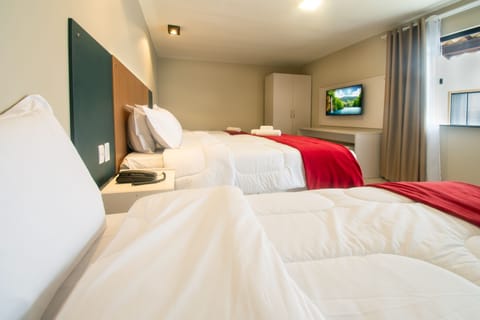 Standard Quadruple Room | Minibar, in-room safe, free WiFi, bed sheets