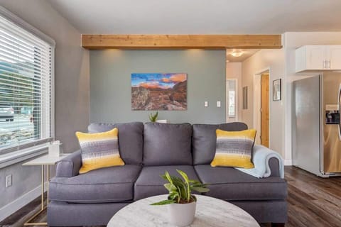 Unwind in our inviting living room, where every detail is curated for your comfort. Sink into the plush sofa and chairs, surrounded by tasteful decor and warm, natural light. Soft throws and cushions add an extra layer of coziness, creating an ideal spot for relaxation.