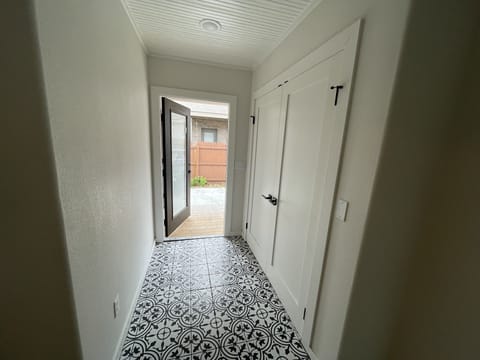 Back door leading to back covered porch/driveway and laundry room