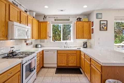 Prepare meals for your family in the spacious kitchen