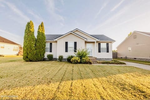 FRONT YARD WITH 2 CAR DRIVEWAY; ALSO STREET PARKING.