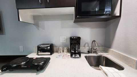 Desk, laptop workspace, blackout drapes, iron/ironing board