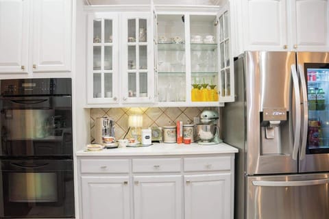 You will find all the glassware and outdoor drinkware you need in the lighted cabinets over the coffee bar.